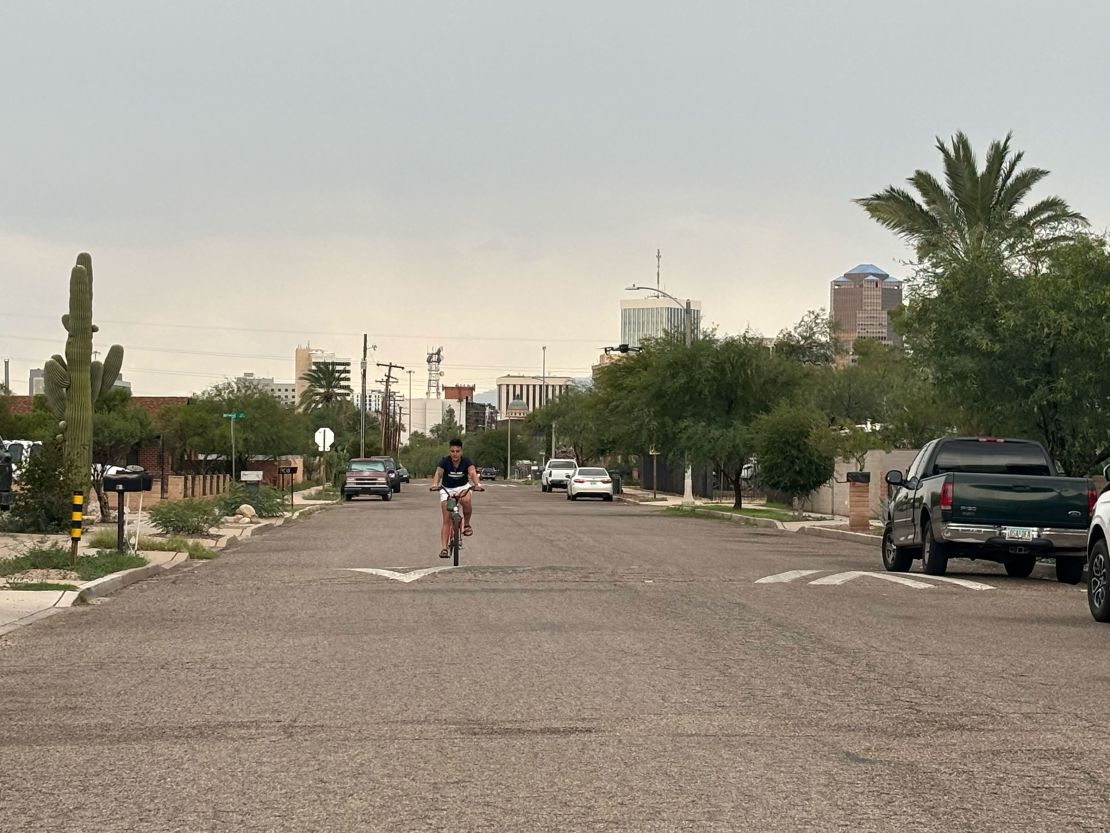 Arizona voter Melissa Cordero rides her bike in Tucson.