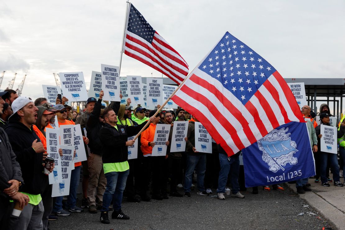 Members of the International Longshoremen's Association union, which represents roughly 45,000 workers, on strike outside the Port of New York and New Jersey on the first day of the strike.